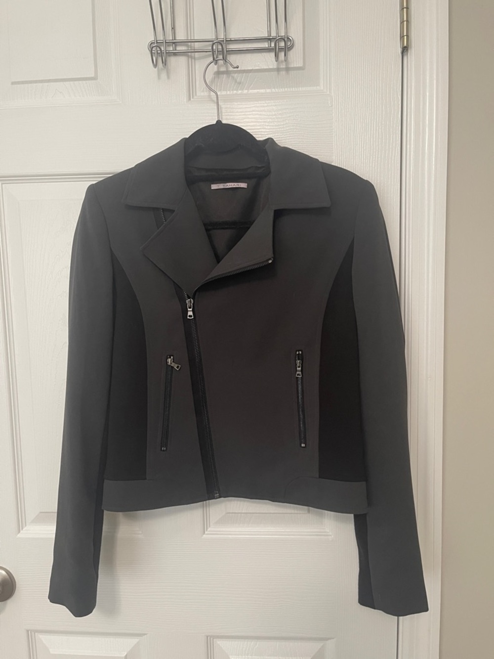 T Tahari woman’s moto jacket